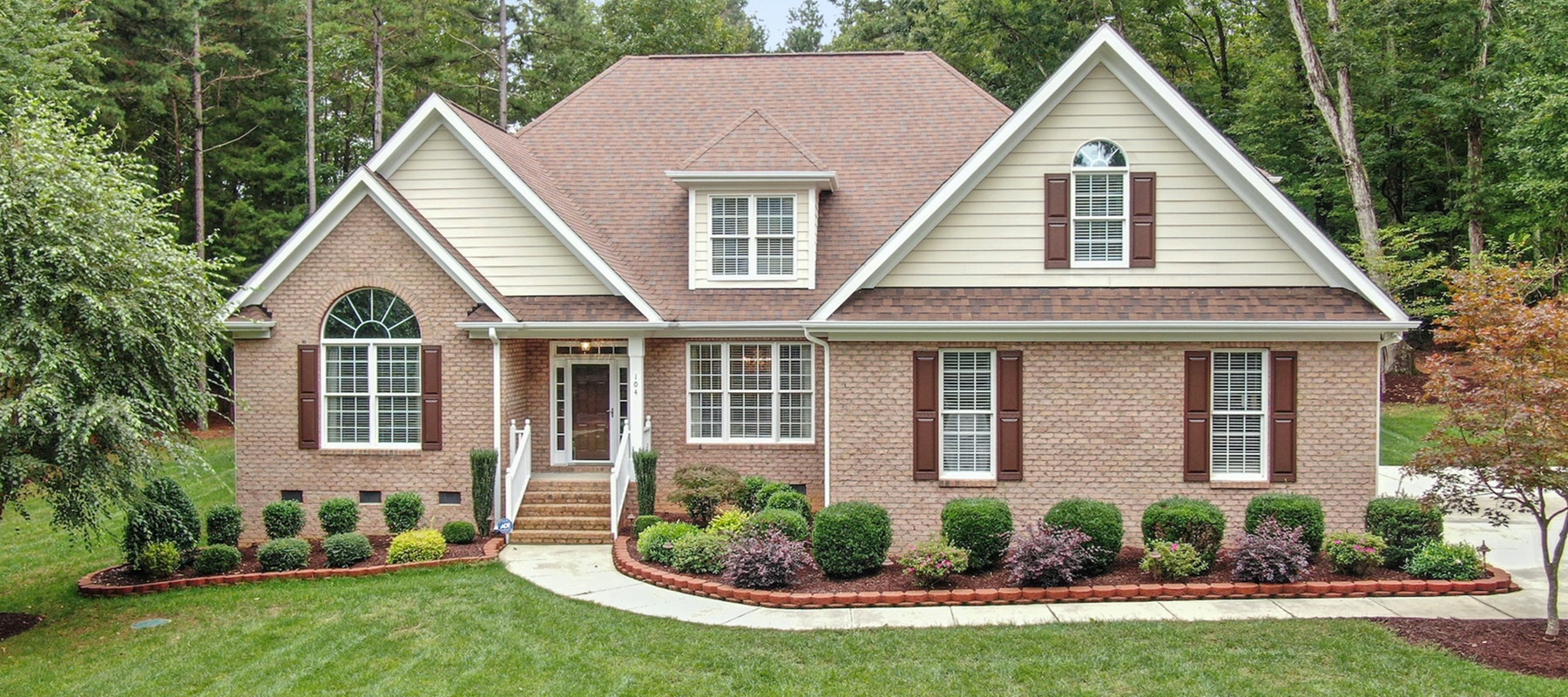 Family in front of new house